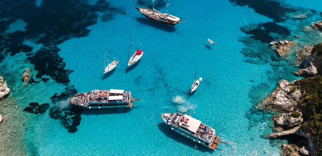 aerial photo o yachts close to Paxos shore